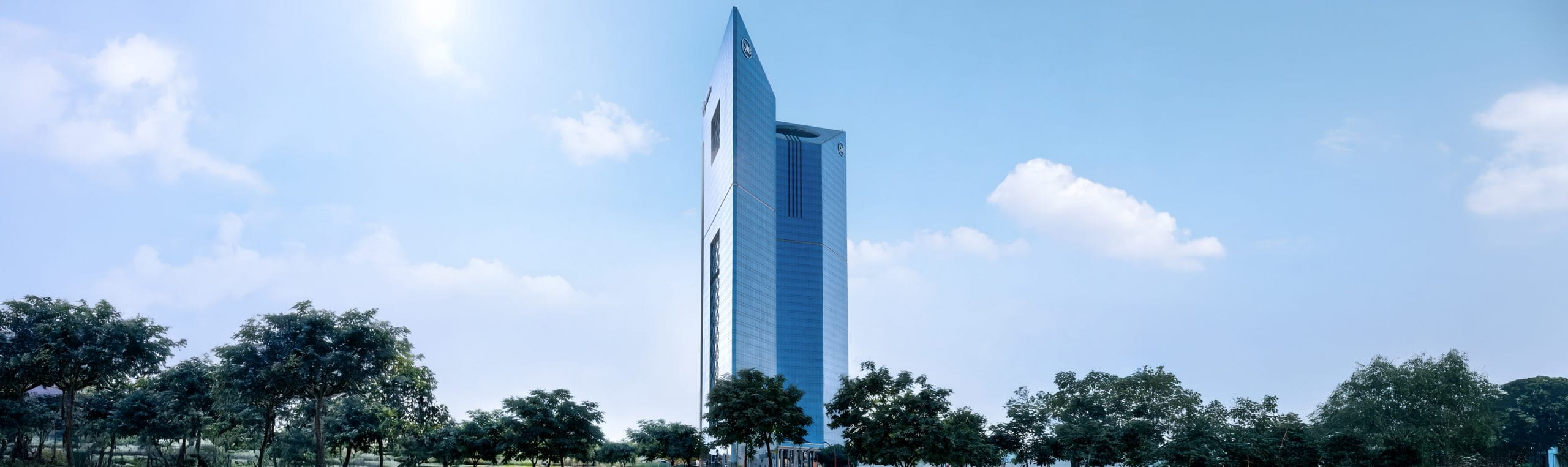 Hero banner image showing Qatar Islamic Bank headquarters exterior